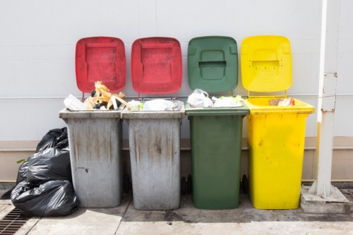 Waste collection truck servicing a residential area in Uxbridge